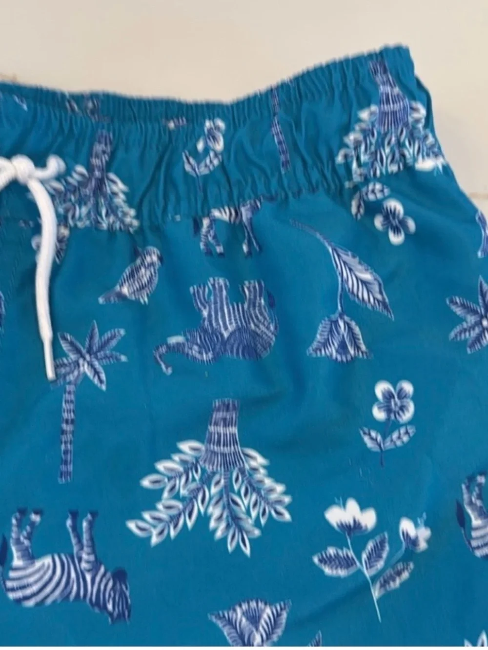 Janie and Jack Teal World Love Swim Trunks with Animal Print